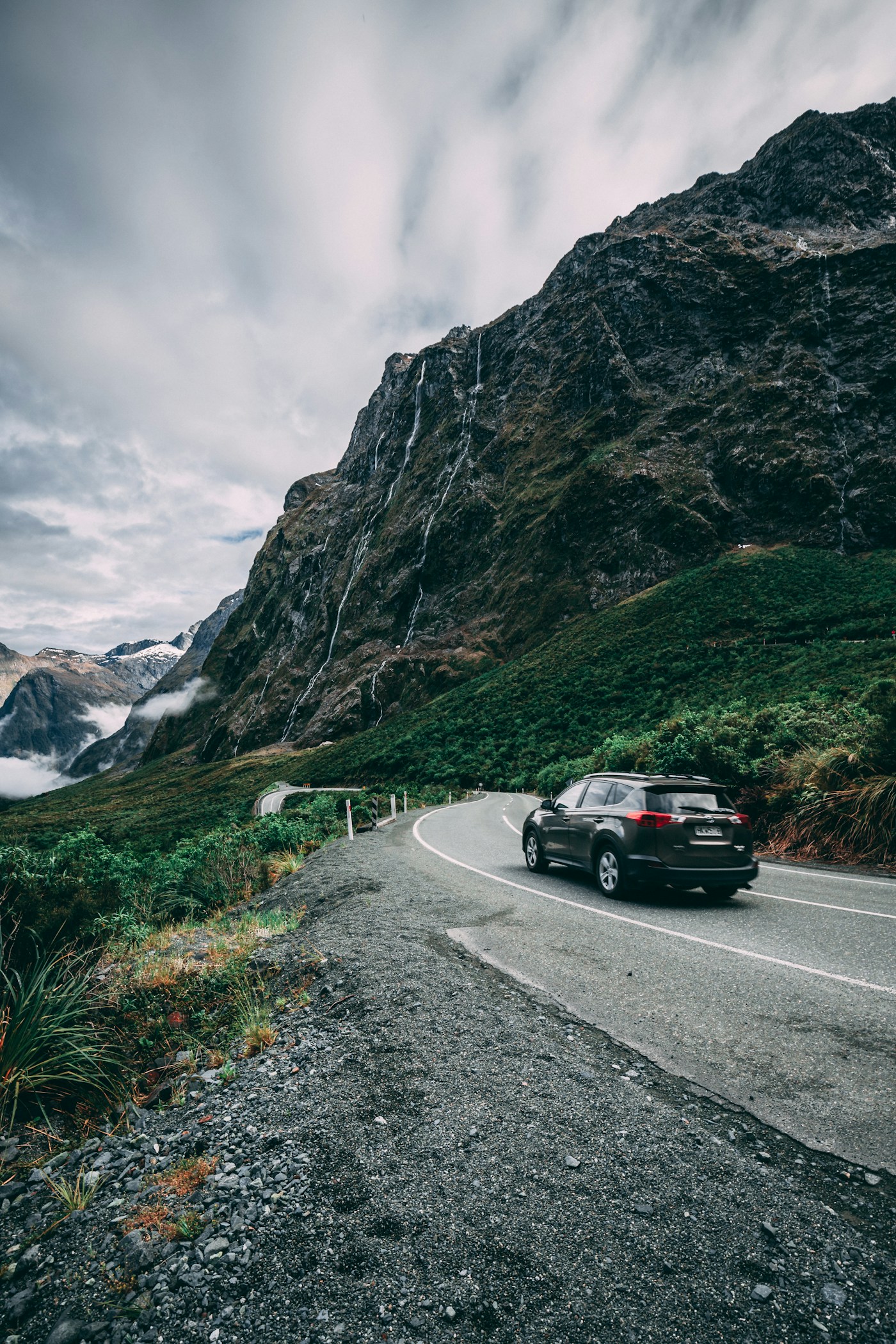 A vehicle on a winding mountain road